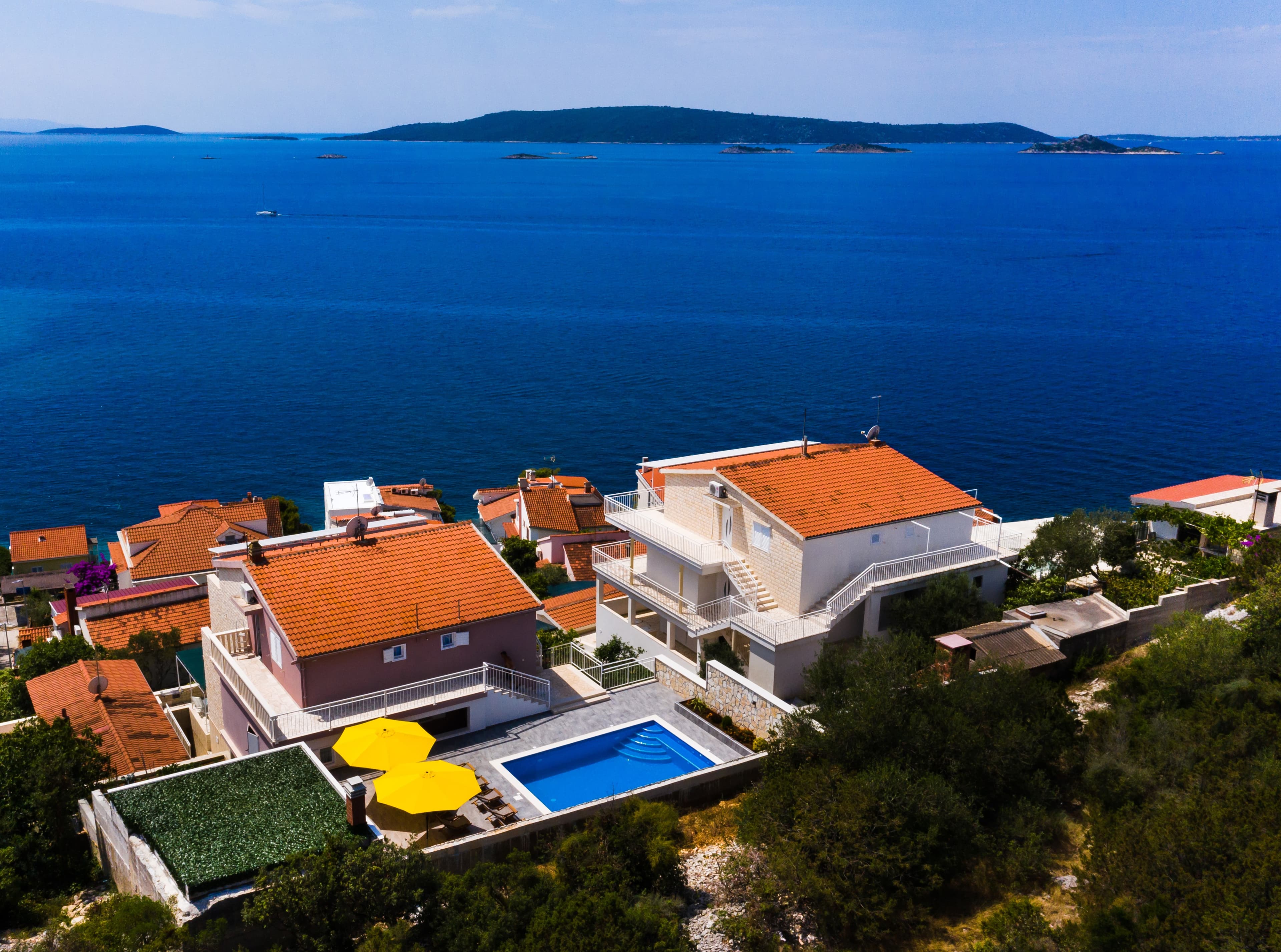 Aerial view of Apartments Care on Island Čiovo with the Adriatic Sea and islands beyond